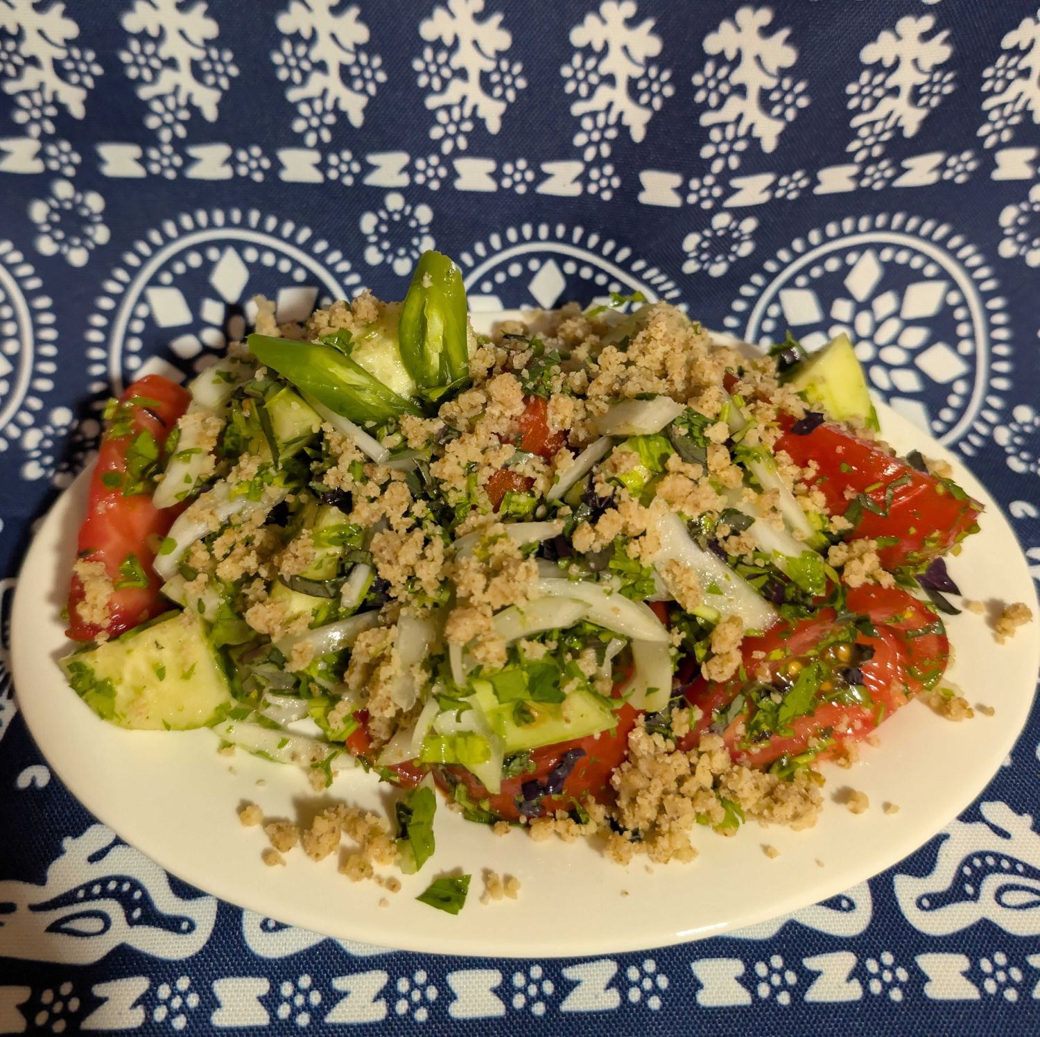 Cucumber tomato salad with traditional Georgian walnut sauce